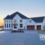 Luxury custom home in Benton, Arkansas with brick and stone exterior built by a Central Arkansas design-build contractor